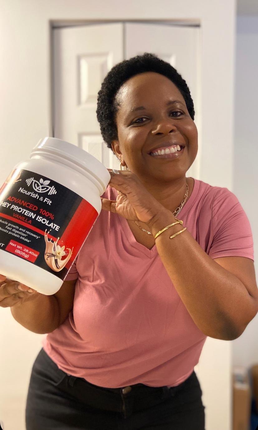Smiling woman holding Nourish & Fit Whey Protein Isolate